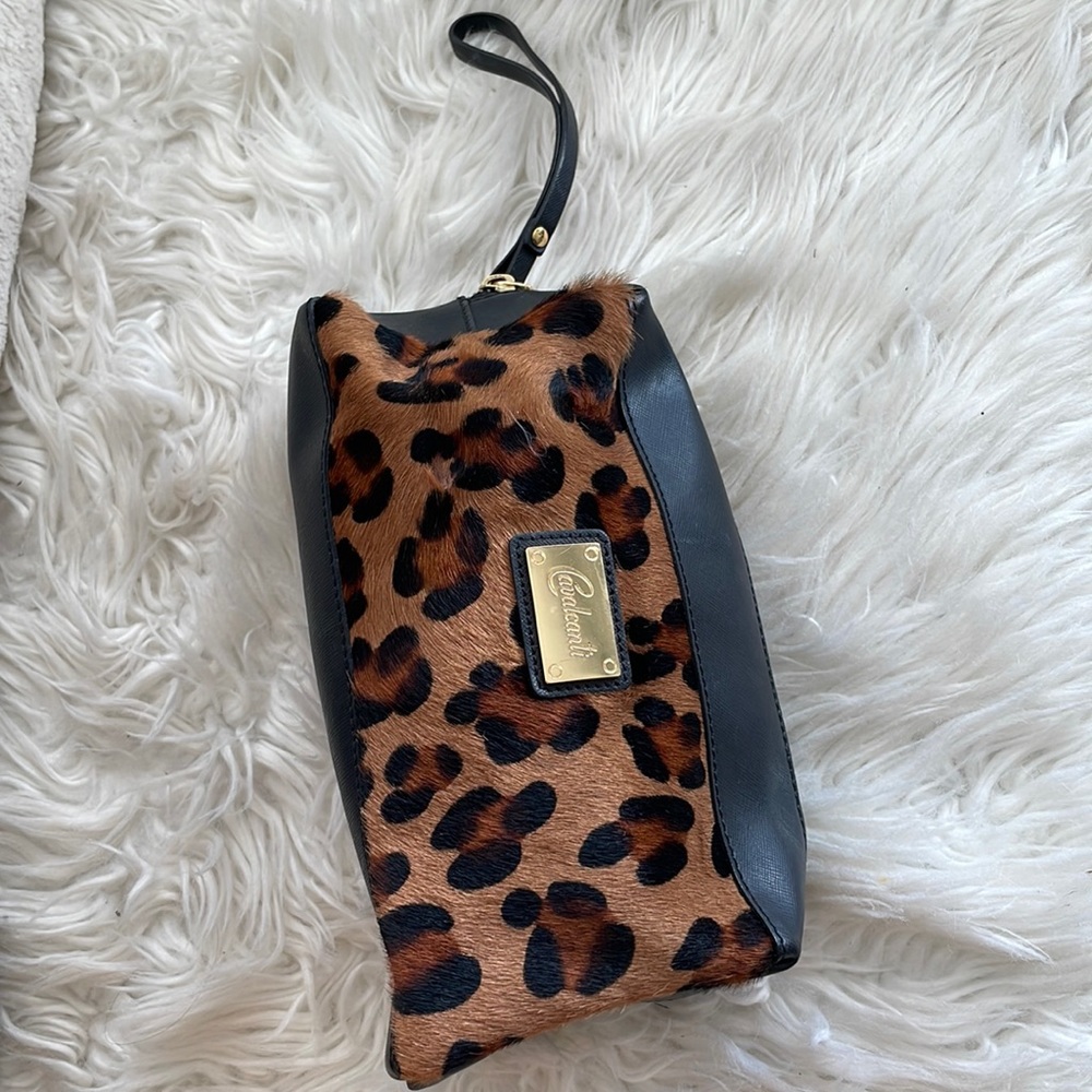 Cavalcanti leopard print w/ black leather wristlet purse. 10” X 6”